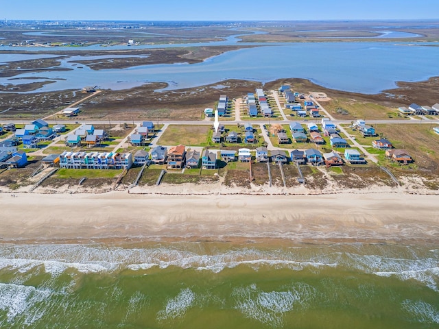 aerial view featuring a view of the beach and a water view