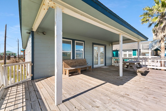 wooden deck featuring french doors