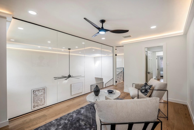 sitting room with recessed lighting, visible vents, ceiling fan, wood finished floors, and baseboards