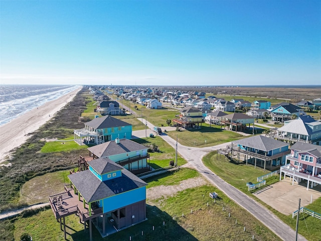 bird's eye view featuring a residential view and a beach view