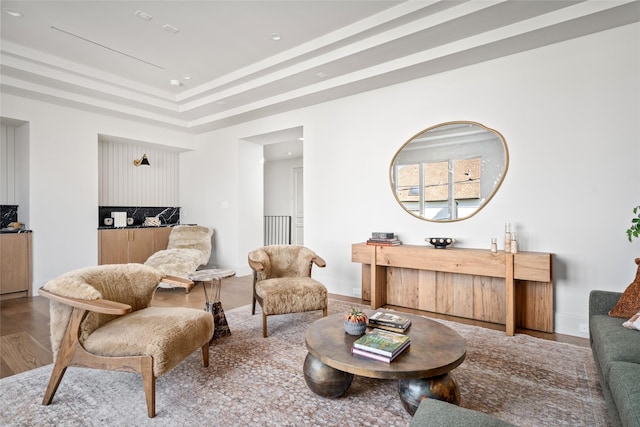 living room featuring a tray ceiling, wood finished floors, and recessed lighting