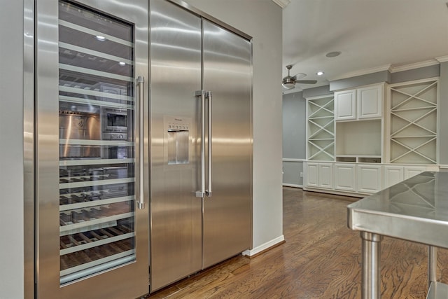 kitchen featuring built in fridge, white cabinetry, ornamental molding, dark wood-style floors, and open shelves