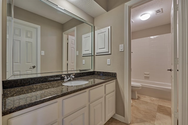 bathroom featuring visible vents, toilet, bathtub / shower combination, a textured ceiling, and vanity