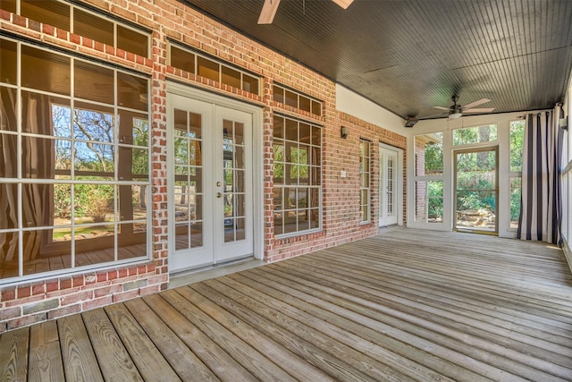 wooden deck with ceiling fan and french doors