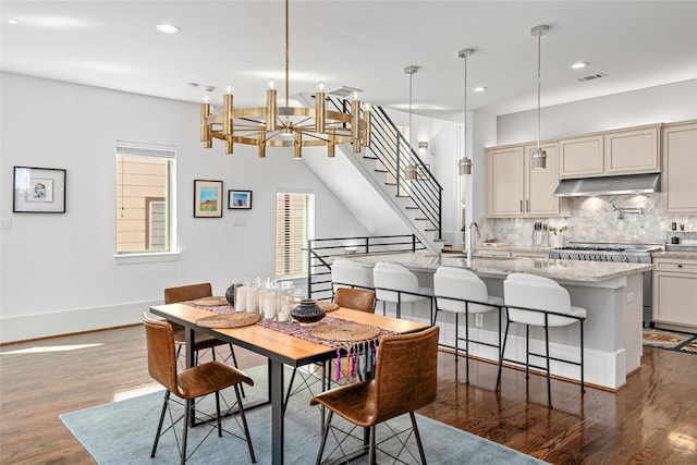 dining space with stairway, dark wood-style flooring, visible vents, and recessed lighting