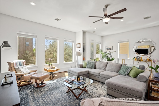 living room featuring recessed lighting, visible vents, ceiling fan, and wood finished floors