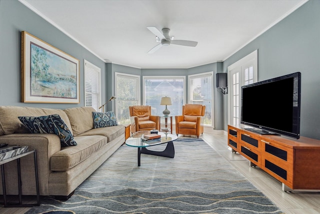 living room featuring tile patterned floors, ornamental molding, and a ceiling fan