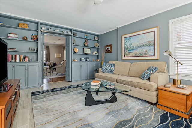 living room featuring wood tiled floor and ornamental molding