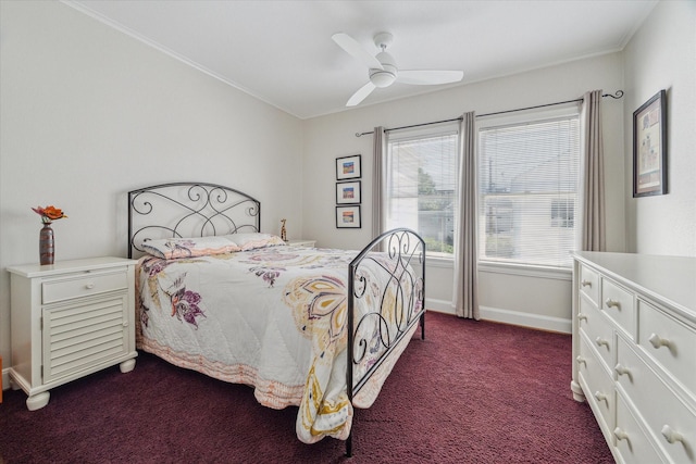 bedroom featuring dark colored carpet, baseboards, ceiling fan, and ornamental molding