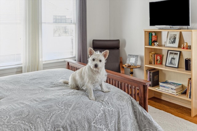 bedroom with wood finished floors