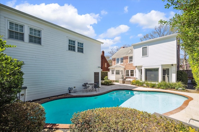 outdoor pool featuring a patio area