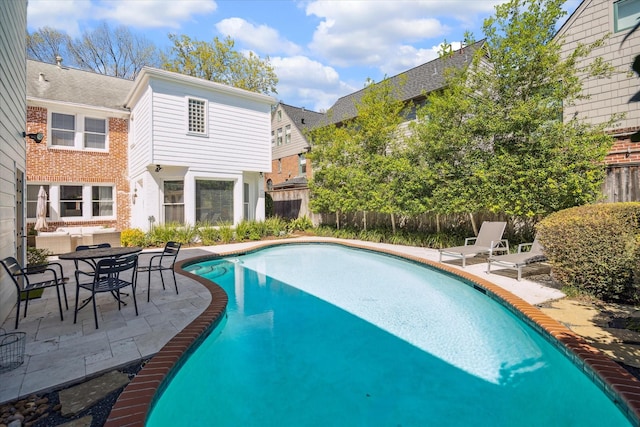 view of pool featuring a fenced in pool, a patio, and a fenced backyard