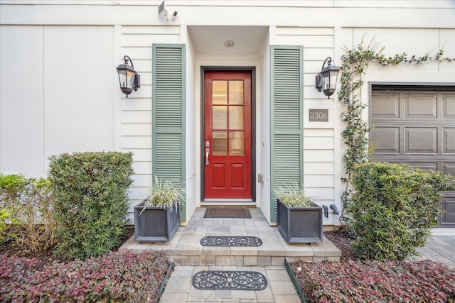 view of exterior entry featuring a garage