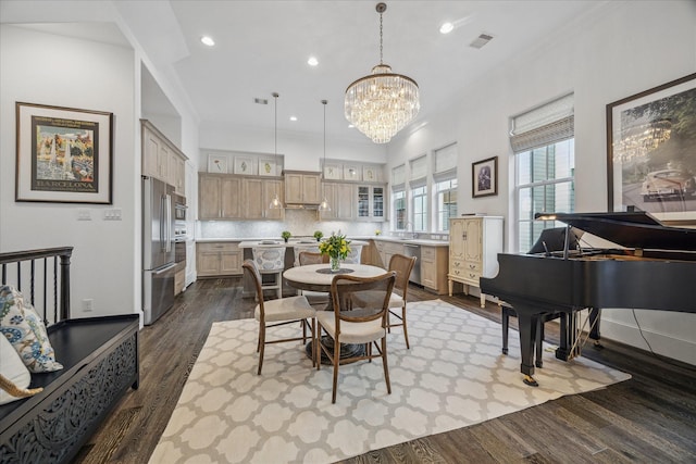 dining room with dark wood-style floors, a notable chandelier, visible vents, and recessed lighting