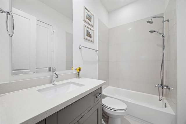 full bath featuring toilet, bathtub / shower combination, and vanity