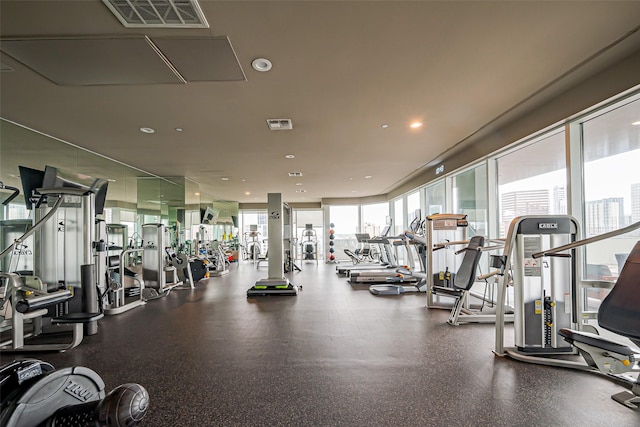 workout area featuring visible vents and recessed lighting