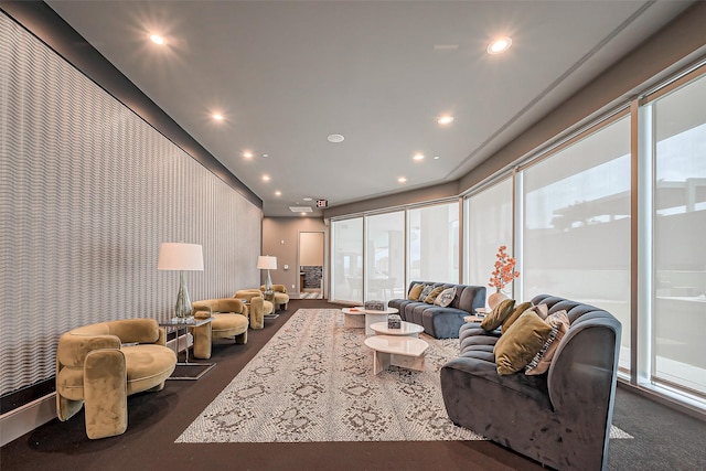 living area featuring wallpapered walls and recessed lighting