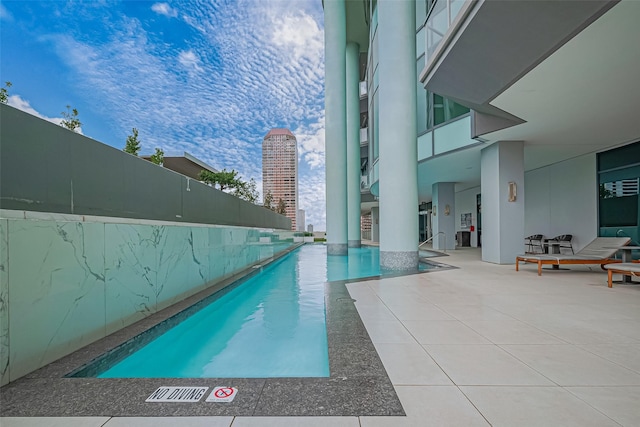 pool featuring a patio area