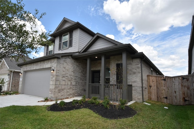 view of front of home featuring driveway, brick siding, a front lawn, and fence