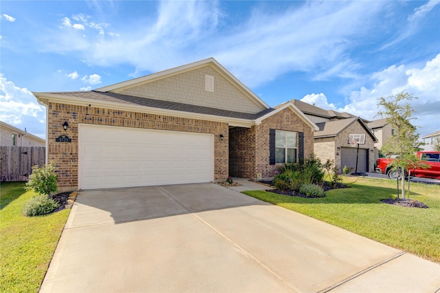 view of front of property with brick siding, an attached garage, a front yard, fence, and driveway