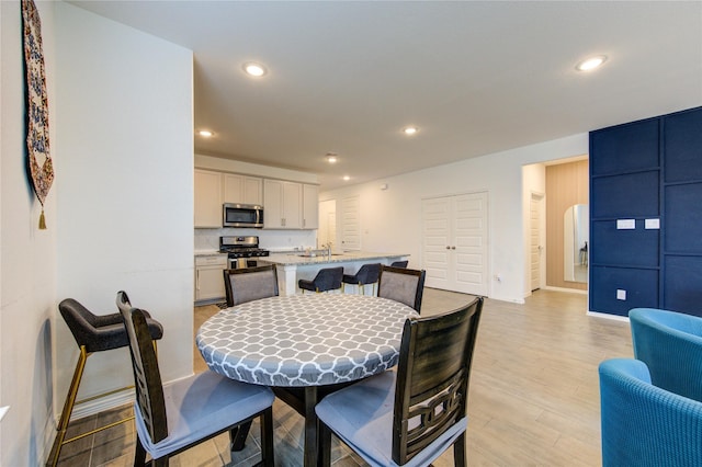 5723 Morning Vista Rd, Katy, TX 77493 - dining space featuring baseboards, light wood-type flooring, and recessed lighting