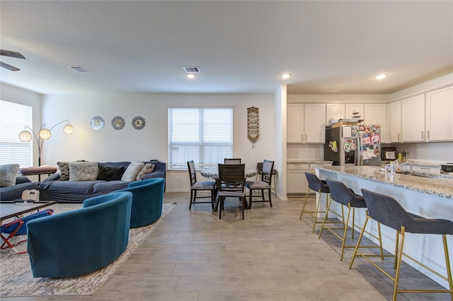 5723 Morning Vista Rd, Katy, TX 77493 - living area with ceiling fan, visible vents, and recessed lighting