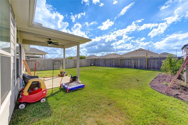 5723 Morning Vista Rd, Katy, TX 77493 - view of yard featuring a ceiling fan and a fenced backyard