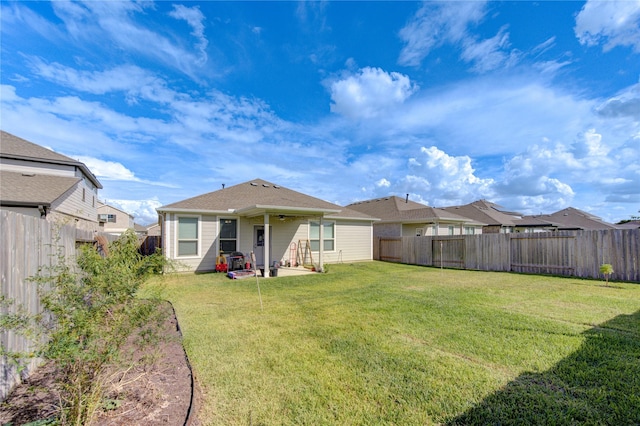 5723 Morning Vista Rd, Katy, TX 77493 - rear view of property with a yard, a patio area, and a fenced backyard