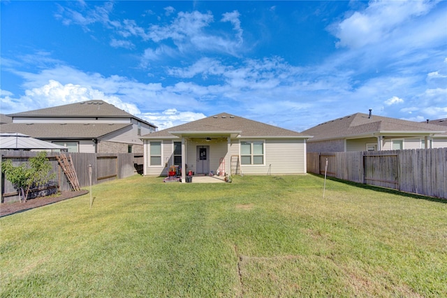 5723 Morning Vista Rd, Katy, TX 77493 - back of house featuring ceiling fan, a yard, a patio, and a fenced backyard