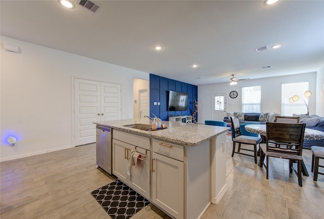 5723 Morning Vista Rd, Katy, TX 77493 - kitchen featuring dishwasher, open floor plan, a sink, and visible vents