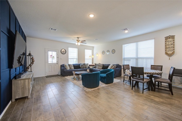 5723 Morning Vista Rd, Katy, TX 77493 - living area featuring a ceiling fan, visible vents, and wood finished floors