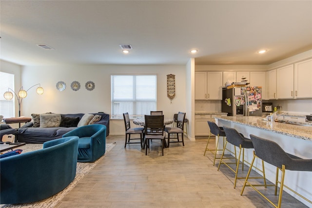 5723 Morning Vista Rd, Katy, TX 77493 - interior space with recessed lighting, visible vents, and light wood-style flooring