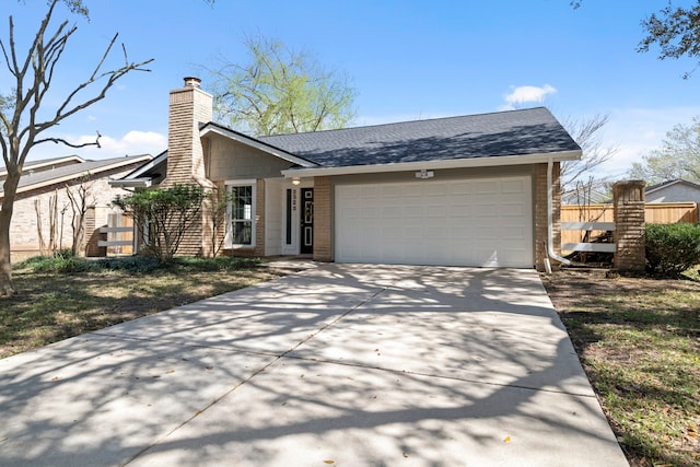 view of front of house with a chimney, a shingled roof, concrete driveway, an attached garage, and fence