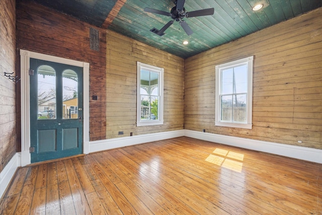 entrance foyer featuring wooden ceiling, ceiling fan, baseboards, and hardwood / wood-style floors