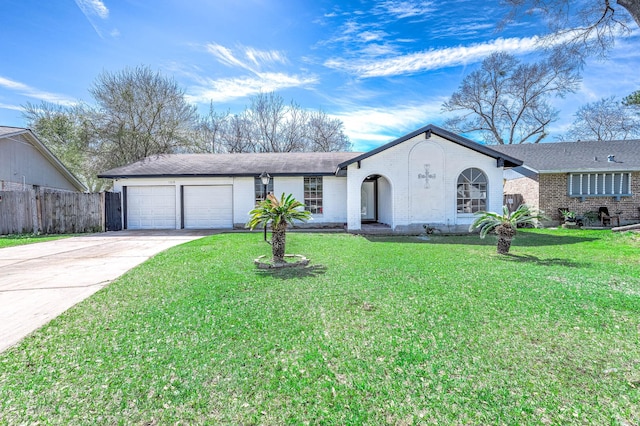 view of front of house featuring brick siding, concrete driveway, a front yard, fence, and a garage