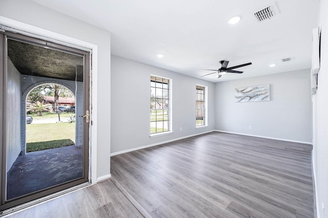 entryway with recessed lighting, wood finished floors, visible vents, and baseboards