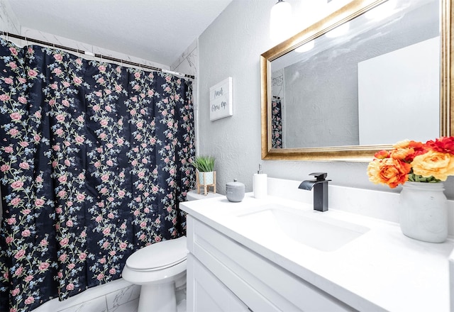 bathroom with a textured wall, a shower with shower curtain, toilet, vanity, and a textured ceiling