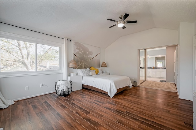 bedroom with lofted ceiling, multiple windows, and wood finished floors