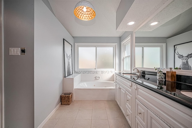 full bathroom with a textured ceiling, tile patterned flooring, a garden tub, a sink, and double vanity