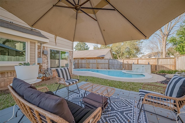 view of patio / terrace featuring a fenced in pool, a fenced backyard, and outdoor lounge area