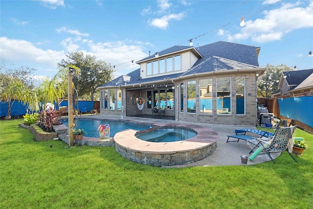 rear view of house with brick siding, fence private yard, roof with shingles, a yard, and a patio area