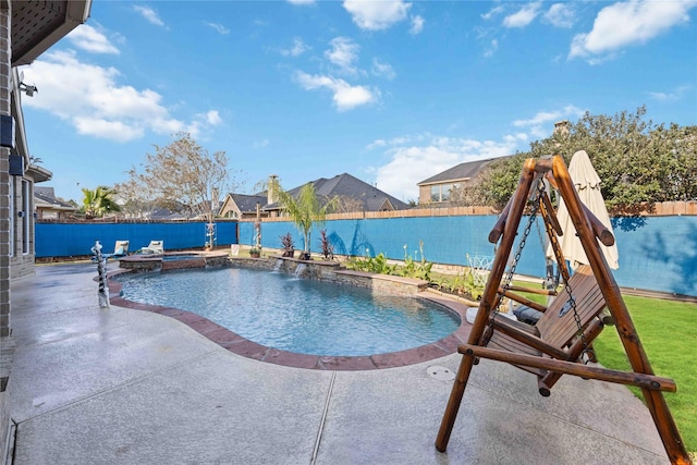 view of pool featuring a patio, a fenced backyard, and a pool with connected hot tub