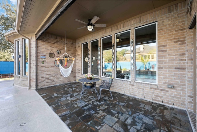 view of patio / terrace featuring ceiling fan