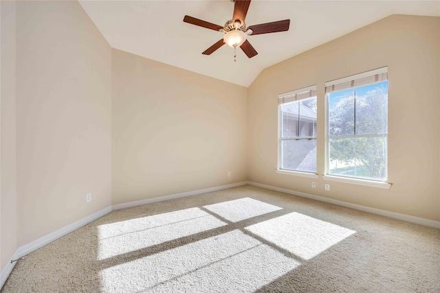 unfurnished room with baseboards, a ceiling fan, lofted ceiling, and carpet floors