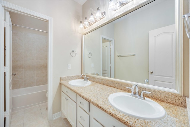 full bathroom with tile patterned flooring, double vanity, shower / washtub combination, and a sink