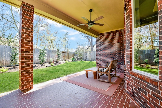 view of patio / terrace with a fenced backyard and ceiling fan