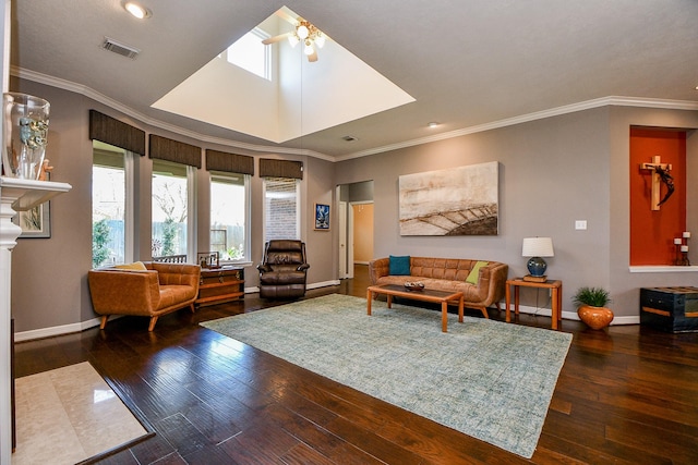 living area featuring a ceiling fan, visible vents, wood-type flooring, and baseboards