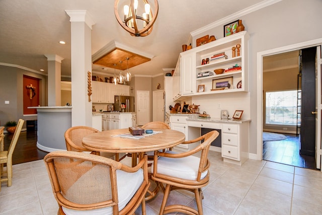 dining area with ornamental molding, light tile patterned floors, and a chandelier