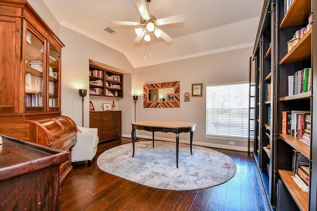 office area with visible vents, dark wood-type flooring, baseboards, lofted ceiling, and ornamental molding