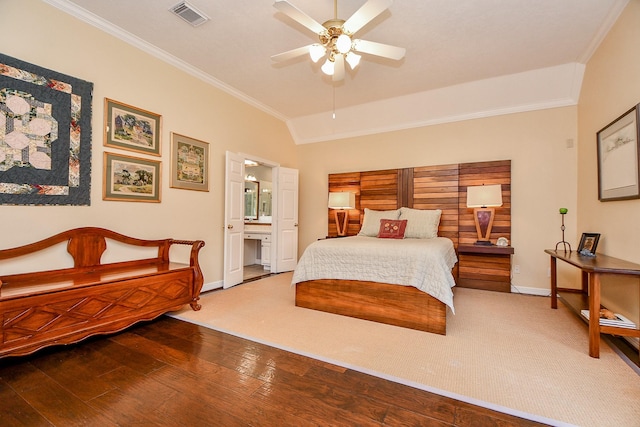 bedroom featuring hardwood / wood-style floors, baseboards, visible vents, lofted ceiling, and ornamental molding